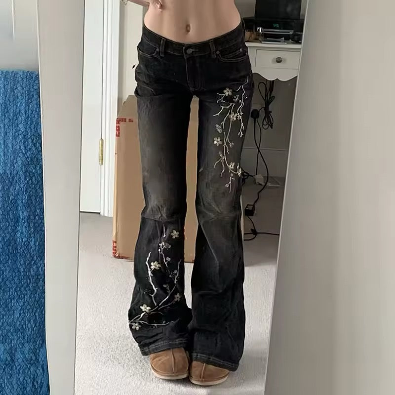 Floral embroidered flare jeans styled with Y2K crop top