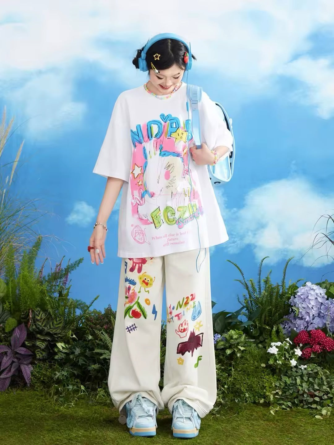 Colorful “PARTY TIME” print with playful hand-drawn elements on the leg of the pants