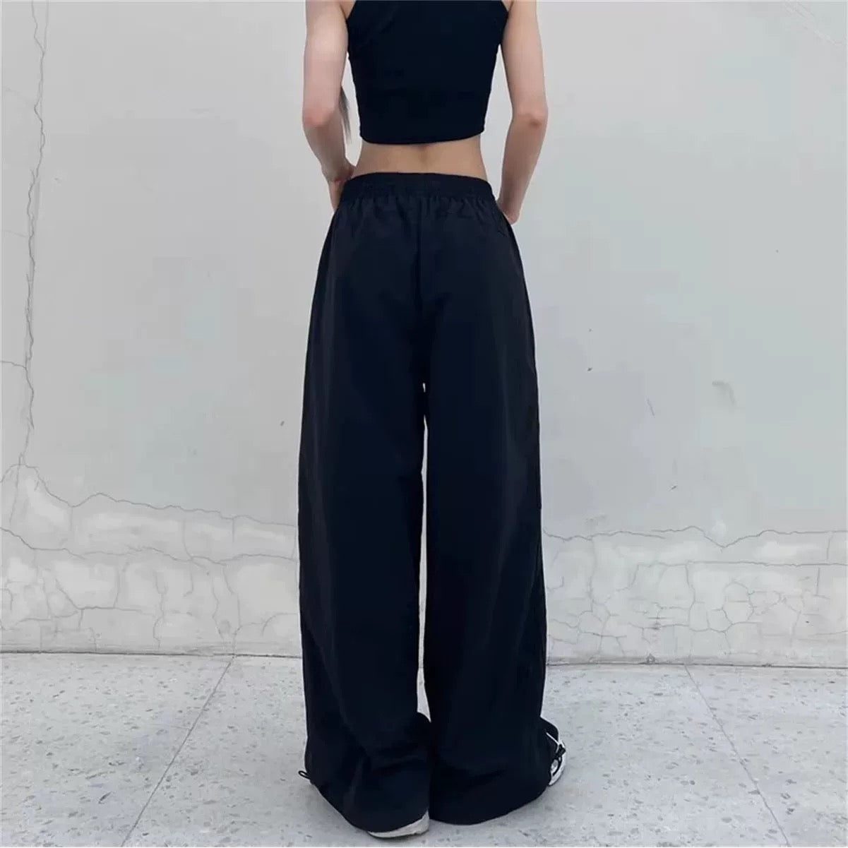 y2k black pants with white stripe design